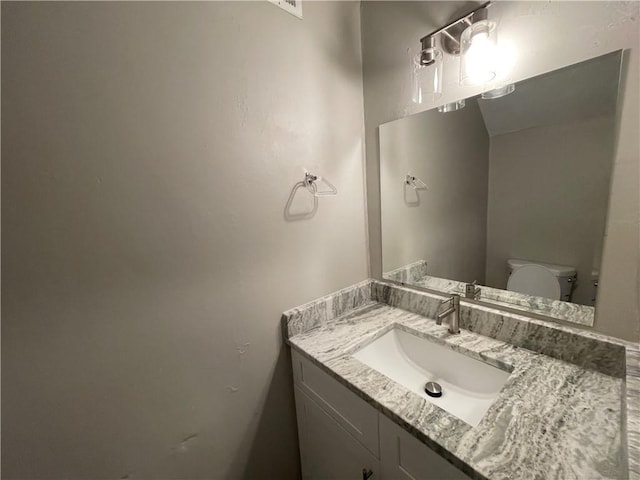 bathroom with vanity and toilet