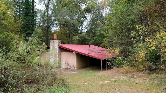 view of outdoor structure with an attached carport