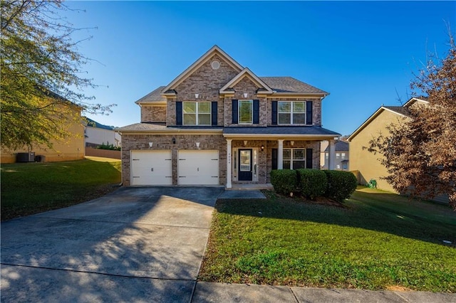 craftsman-style home with a front yard and a garage