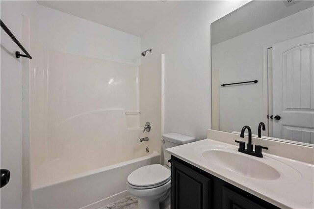 full bathroom featuring shower / bathing tub combination, vanity, and toilet