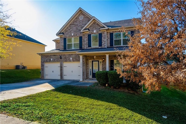 view of front of home featuring a garage and a front lawn