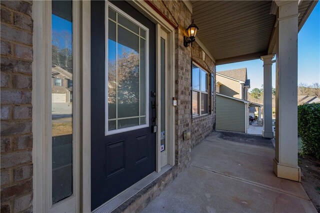 property entrance featuring covered porch