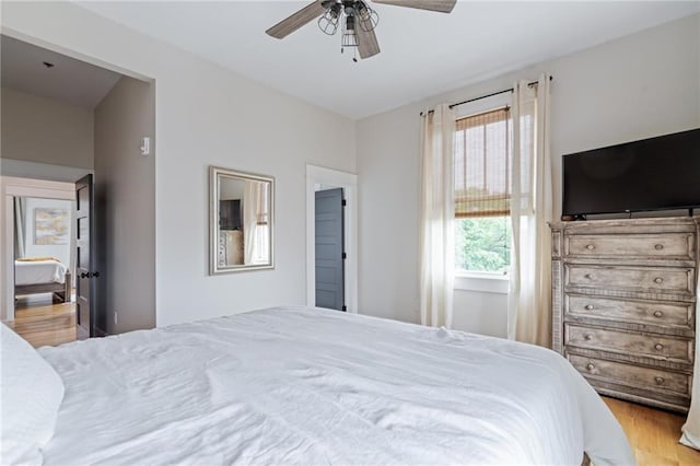 bedroom featuring ceiling fan and light wood finished floors