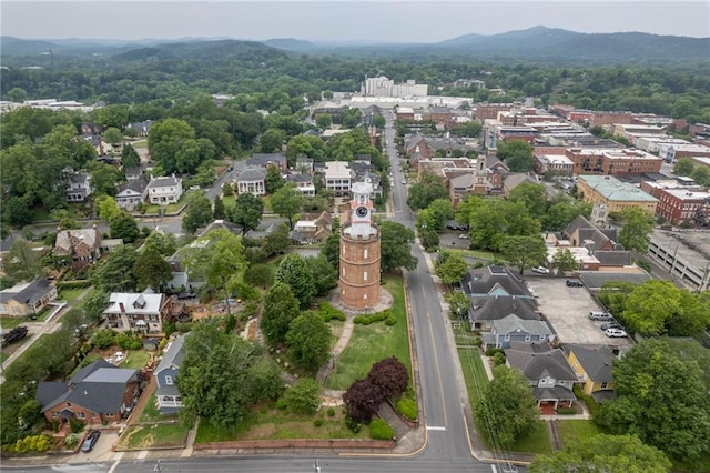 drone / aerial view featuring a residential view and a mountain view