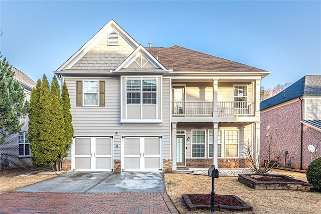 view of front of house with a balcony and a garage