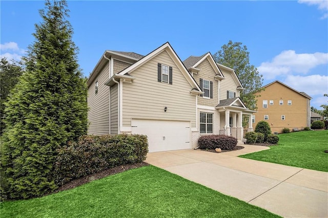 traditional home with a garage, a front lawn, and driveway