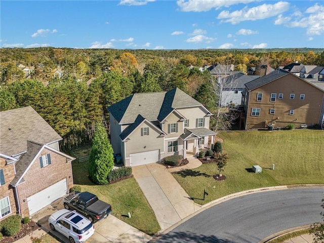 aerial view featuring a view of trees and a residential view