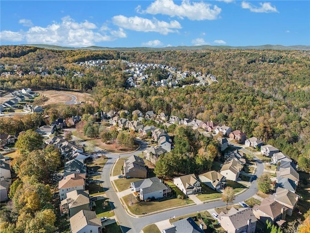 birds eye view of property with a residential view and a wooded view
