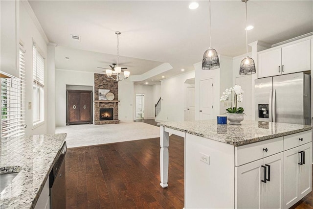 kitchen with white cabinetry, appliances with stainless steel finishes, dark wood-style floors, and ceiling fan