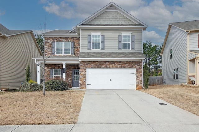 craftsman-style home with a garage, driveway, and fence