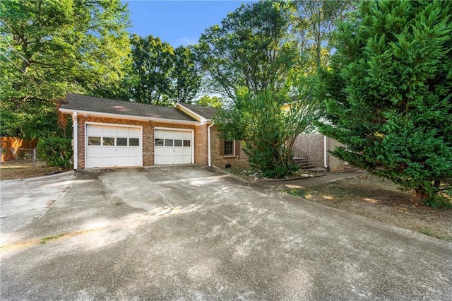 view of side of property featuring a garage