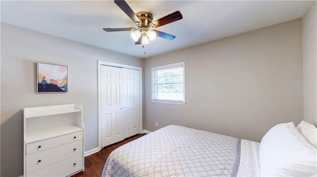 bedroom featuring a closet, dark wood-type flooring, and ceiling fan