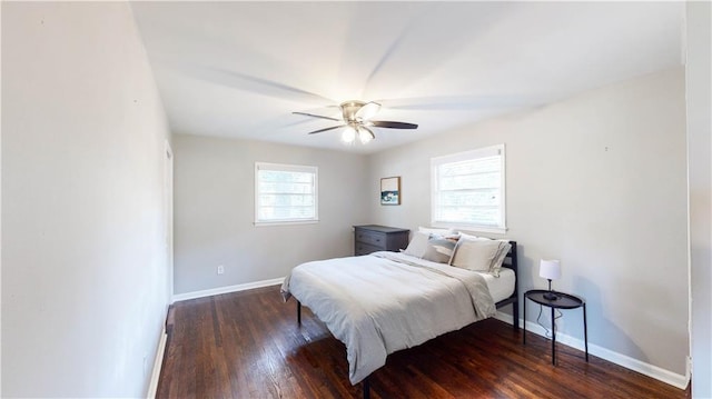 bedroom with dark wood-type flooring and ceiling fan