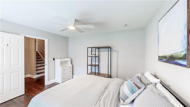 bedroom with dark wood-type flooring and ceiling fan