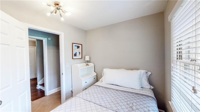 bedroom with light tile patterned floors