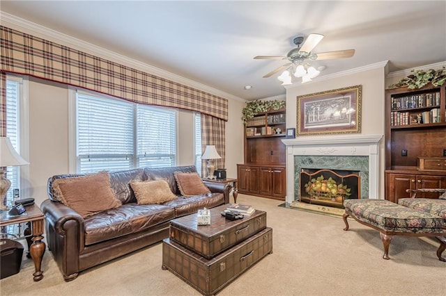 living room with a wealth of natural light, a high end fireplace, carpet flooring, and crown molding