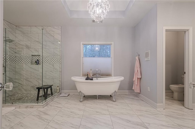 full bathroom with a shower stall, baseboards, toilet, a soaking tub, and marble finish floor