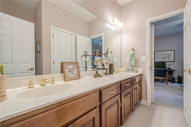 full bath with a sink and double vanity