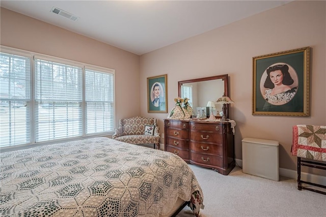 bedroom with carpet, visible vents, and baseboards