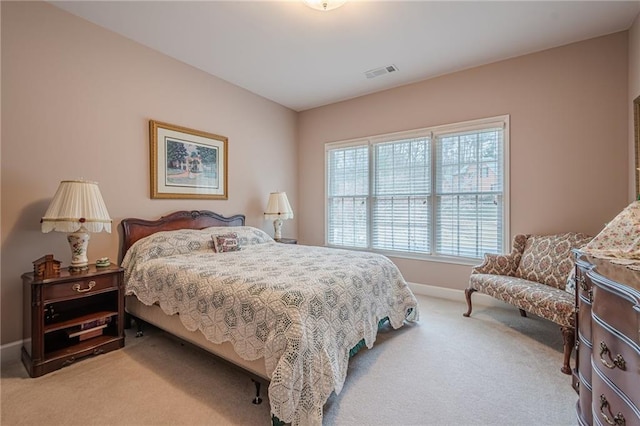 bedroom with carpet flooring, baseboards, and visible vents