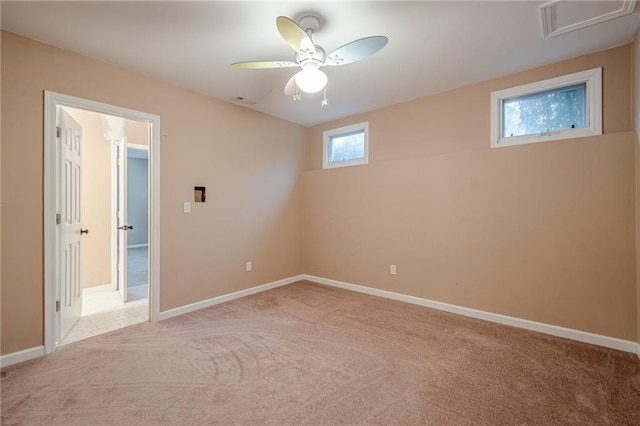 interior space featuring visible vents, baseboards, carpet, and a ceiling fan