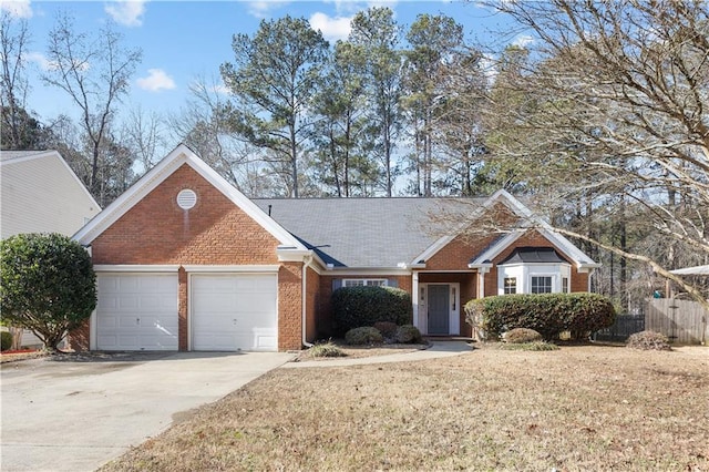 view of front of property featuring a front lawn and a garage