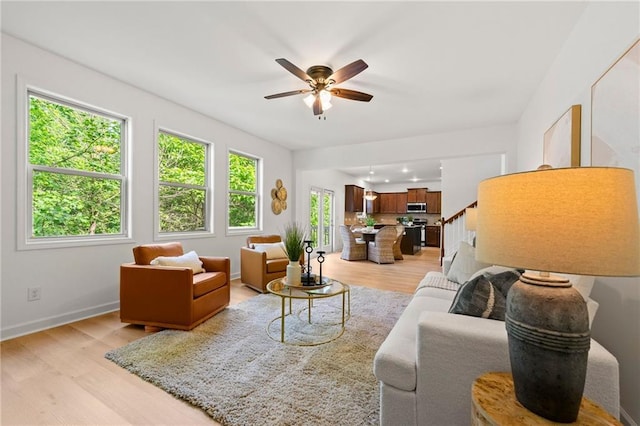 325 Cranbrooke Cir, Suwanee, GA 30024 - living room with light wood finished floors and a ceiling fan
