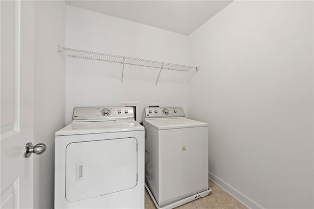 325 Cranbrooke Cir, Suwanee, GA 30024 - laundry room featuring washer and dryer and light tile patterned floors