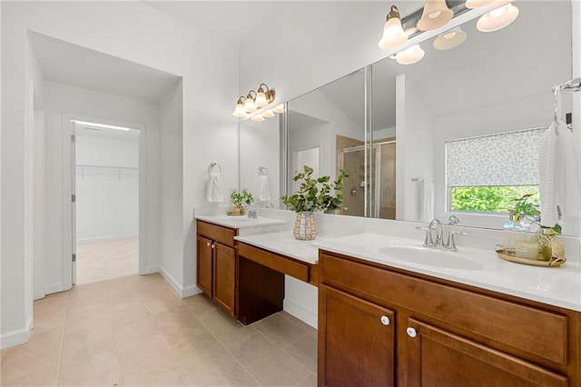 325 Cranbrooke Cir, Suwanee, GA 30024 - bathroom featuring a stall shower, double vanity, a spacious closet, a chandelier, and tile patterned floors
