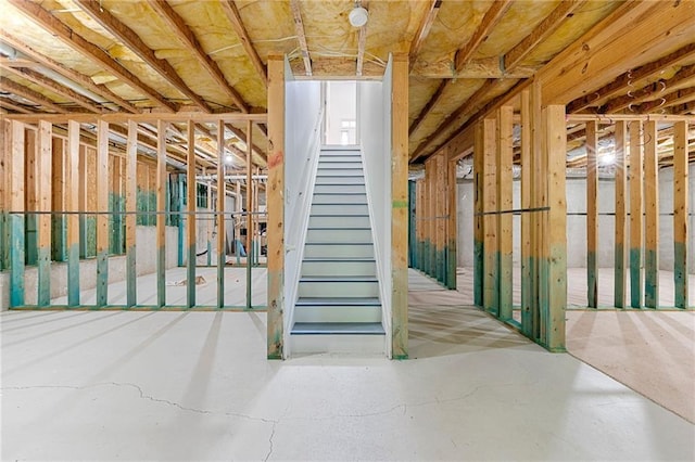 325 Cranbrooke Cir, Suwanee, GA 30024 - misc room with concrete flooring and stairway