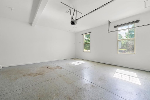 325 Cranbrooke Cir, Suwanee, GA 30024 - garage with a garage door opener and baseboards