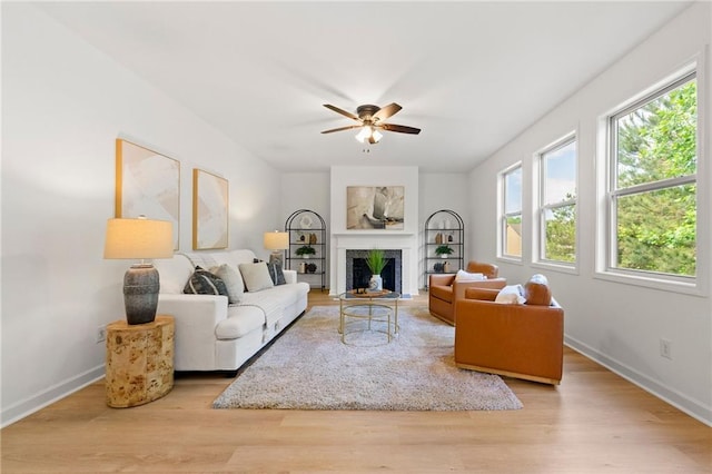325 Cranbrooke Cir, Suwanee, GA 30024 - living area featuring ceiling fan, wood finished floors, and a fireplace with flush hearth