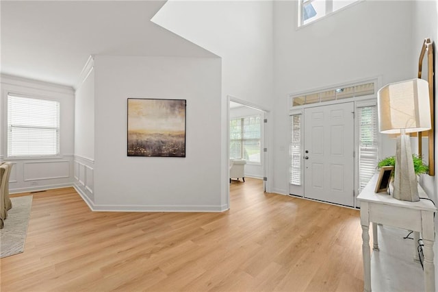 325 Cranbrooke Cir, Suwanee, GA 30024 - entryway with light wood-style floors and ornamental molding
