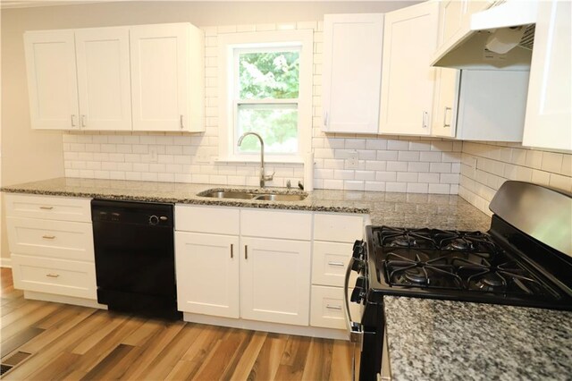 kitchen featuring black appliances, white cabinetry, sink, and light hardwood / wood-style floors