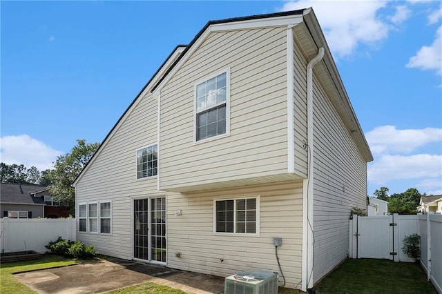 139 W Oaks Pl, Woodstock, GA 30188 - back of house with a gate, a fenced backyard, and a patio