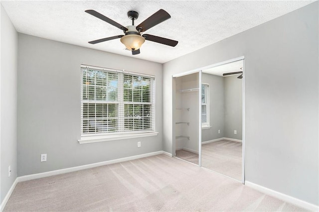 139 W Oaks Pl, Woodstock, GA 30188 - unfurnished bedroom featuring a closet, carpet, a textured ceiling, and ceiling fan