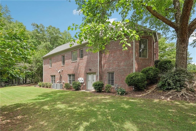 3235 Munsey Ct, Cumming, GA 30041 - rear view of house with a yard and brick siding