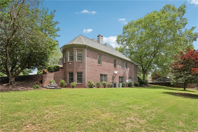 3235 Munsey Ct, Cumming, GA 30041 - rear view of property with brick siding, a lawn, and a chimney