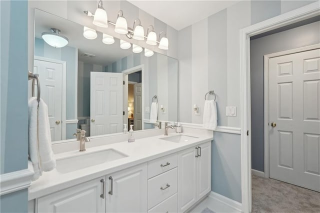 3235 Munsey Ct, Cumming, GA 30041 - full bathroom featuring double vanity and baseboards
