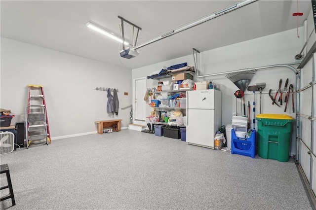 3235 Munsey Ct, Cumming, GA 30041 - garage featuring freestanding refrigerator and a garage door opener