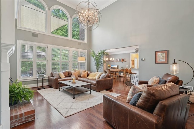 3235 Munsey Ct, Cumming, GA 30041 - living area with a chandelier, a high ceiling, and wood finished floors
