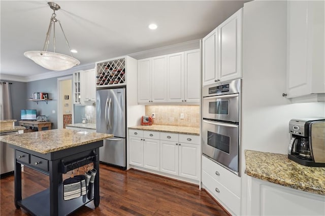3235 Munsey Ct, Cumming, GA 30041 - kitchen featuring stainless steel appliances, white cabinetry, crown molding, and recessed lighting