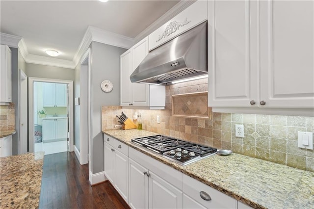 3235 Munsey Ct, Cumming, GA 30041 - kitchen featuring under cabinet range hood, stainless steel gas cooktop, dark wood-style floors, white cabinets, and crown molding