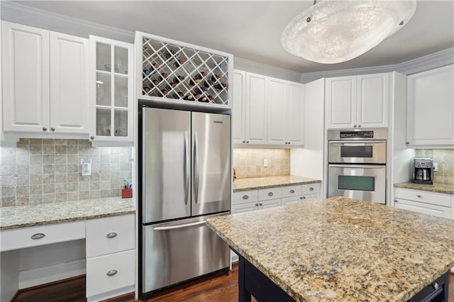 3235 Munsey Ct, Cumming, GA 30041 - kitchen featuring stainless steel appliances, backsplash, white cabinetry, and glass insert cabinets