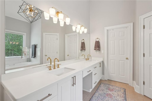 3235 Munsey Ct, Cumming, GA 30041 - bathroom with double vanity, tile patterned floors, and a chandelier