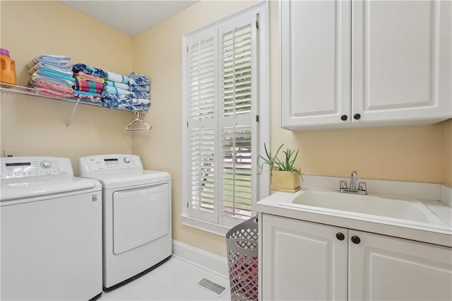 3235 Munsey Ct, Cumming, GA 30041 - laundry room featuring washer and clothes dryer and cabinet space
