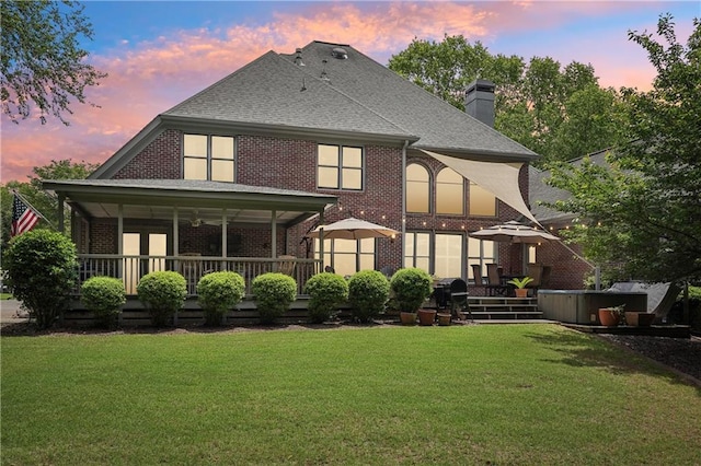 3235 Munsey Ct, Cumming, GA 30041 - rear view of property featuring brick siding, a lawn, a chimney, and roof with shingles