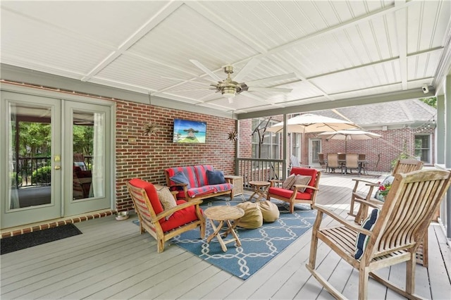 3235 Munsey Ct, Cumming, GA 30041 - wooden terrace with outdoor lounge area, french doors, outdoor dining space, and a ceiling fan