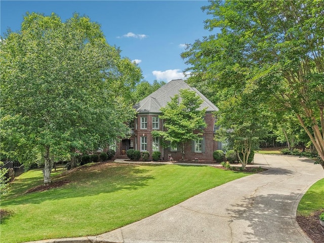 3235 Munsey Ct, Cumming, GA 30041 - view of front of home featuring a front yard, concrete driveway, and brick siding