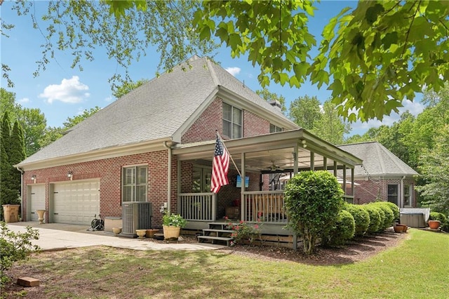 3235 Munsey Ct, Cumming, GA 30041 - view of front facade featuring brick siding, a garage, a front lawn, driveway, and covered porch